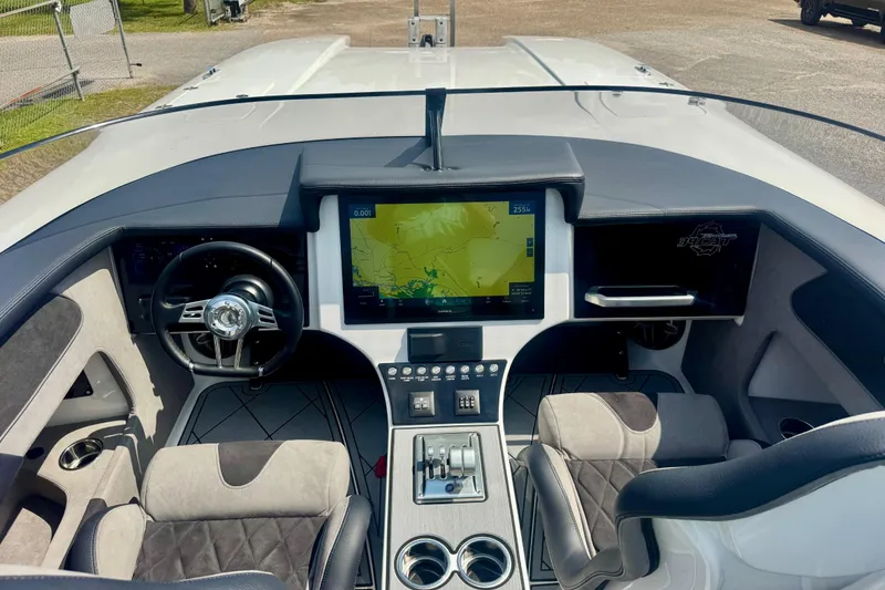 Slide: The Image of 2024 Fountain 34 Thundercat cockpit with modern navigation display and luxurious seating. - 13