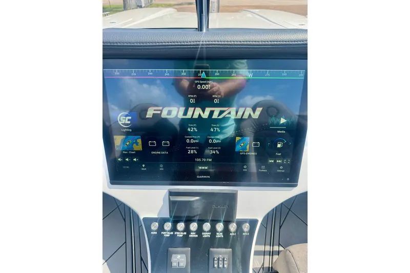 Slide: The Image of Dashboard of 2024 Fountain 34 Thundercat boat with digital display and controls. - 14