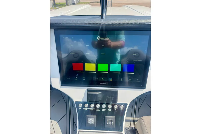 Slide: The Image of 2024 Fountain 34 Thundercat dashboard with touchscreen display and control panel. - 15