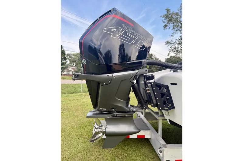 Slide: The Image of Outboard motor of 2024 Fountain 34 Thundercat on a trailer, showcasing powerful engine design. - 24