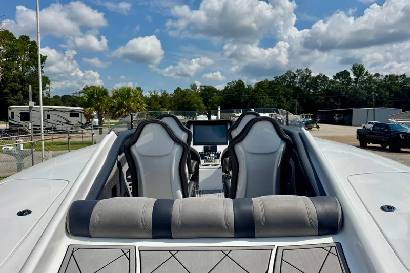 Slide: The Image of 2024 Fountain 34 Thundercat boat interior with sleek seating and modern dashboard. - 5