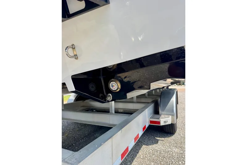 Slide: The Image of 2024 Fountain 34 Thundercat boat on trailer, showcasing hull and trailer details. - 6