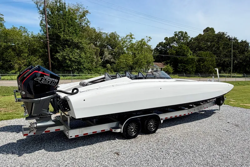 Slide: The Image of 2024 Fountain 34 Thundercat boat on trailer, featuring powerful outboard engines. - 31