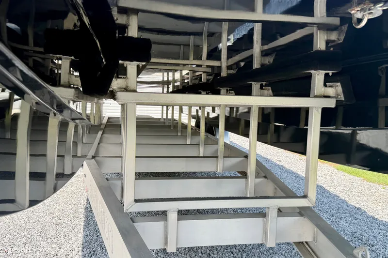Slide: The Image of Underneath view of 2024 Fountain 34 Thundercat boat on a trailer. - 27