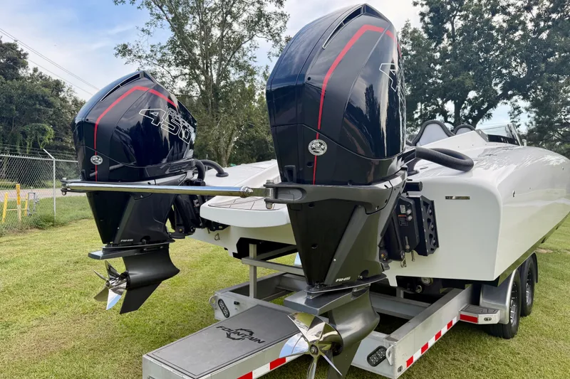 Slide: The Image of 2024 Fountain 34 Thundercat boat with dual powerful outboard engines on a trailer. - 23