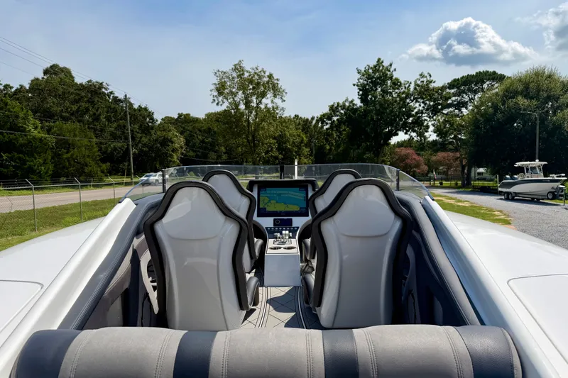 Slide: The Image of 2024 Fountain 34 Thundercat boat interior with sleek seats and modern dashboard. - 38
