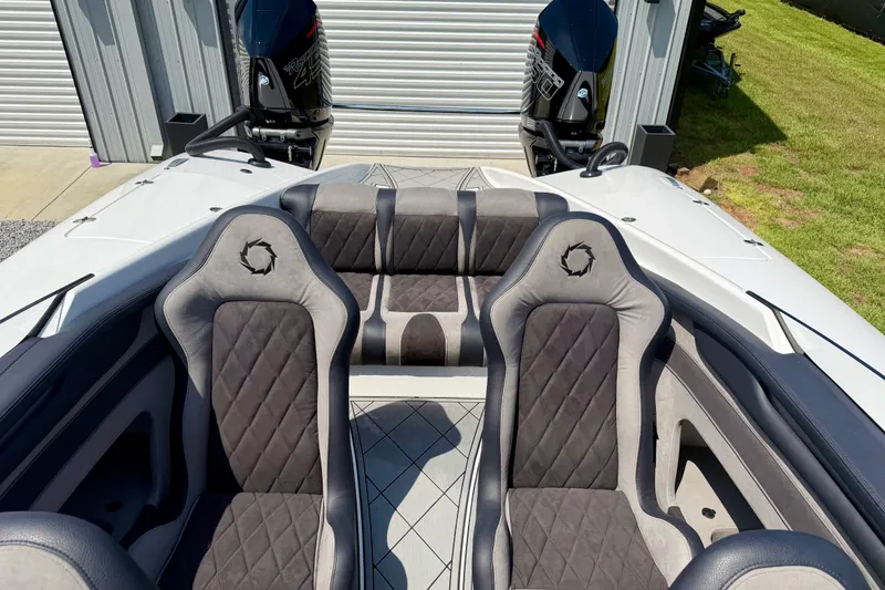Slide: The Image of 2024 Fountain 34 Thundercat boat interior with dual seats and powerful engines. - 40