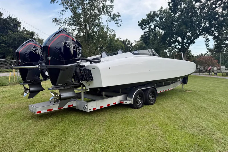 Slide: The Image of 2024 Fountain 34 Thundercat boat on trailer with dual outboard engines. - 22