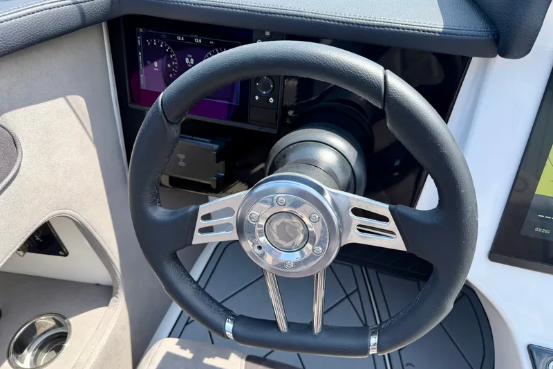 Slide: The Image of Steering wheel of 2024 Fountain 34 Thundercat boat with modern dashboard display. - 45