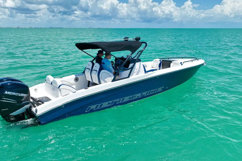 Slide: The Image of 2018 Renegade 32' Cuddy boat cruising on turquoise waters under a cloudy sky. - 13
