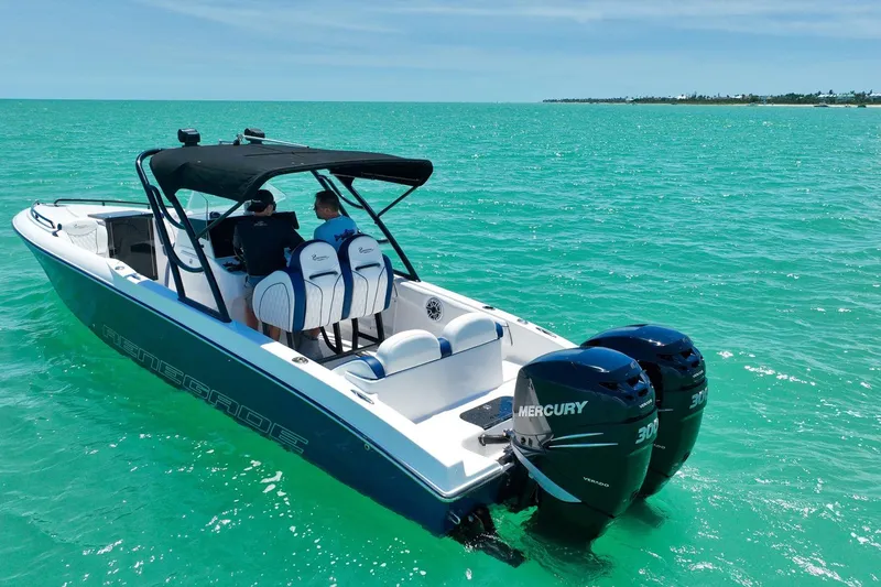 Slide: The Image of 2018 Renegade 32' Cuddy boat on turquoise waters. - 16