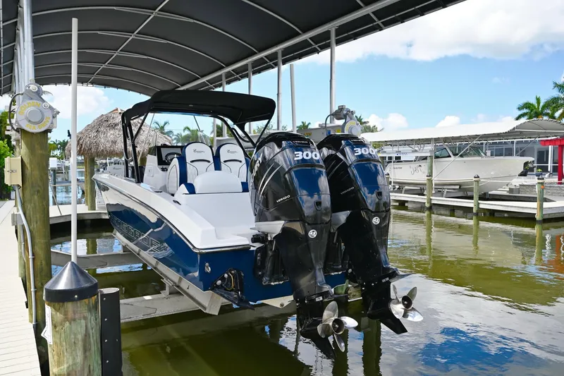 Slide: The Image of 2018 Renegade 32' Cuddy boat docked with twin engines. - 5