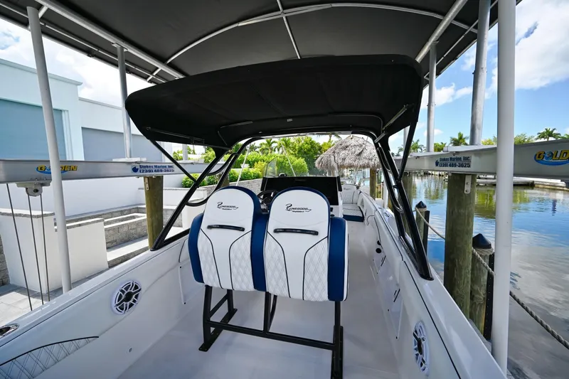 Slide: The Image of Interior view of a 2018 Renegade 32' Cuddy boat with seating. - 7