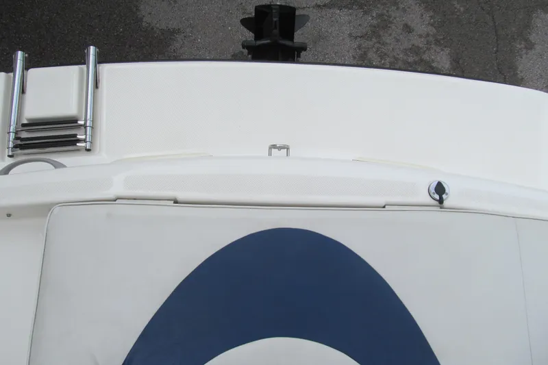 Slide: The Image of 2005 Bayliner 185 boat deck with ladder and blue design. - 12