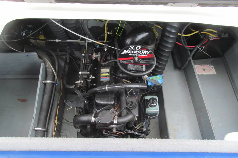 Slide: The Image of Engine compartment of a 2005 Bayliner 185 with a 3.0L MerCruiser engine. - 13