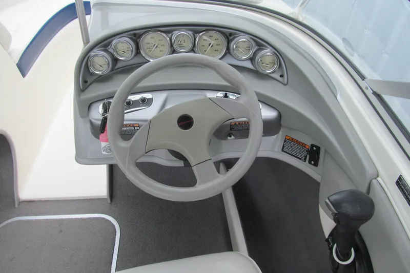 Slide: The Image of Interior view of 2005 Bayliner 185 boat cockpit. - 6