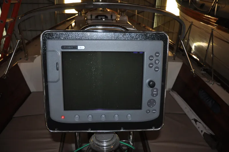 Slide: The Image of Navigation system on a 1970 Hinckley Bermuda 40 sailboat, docked indoors. - 13