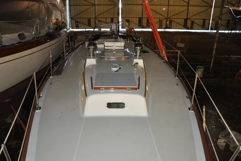 Slide: The Image of 1970 Hinckley Bermuda 40 sailboat in a storage facility, viewed from above. - 14