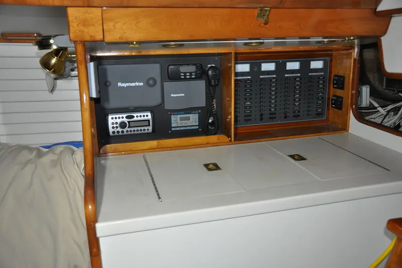 Slide: The Image of Navigation equipment and control panel inside a 1970 Hinckley Bermuda 40 sailboat cabin. - 20