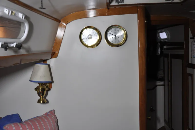 Slide: The Image of Interior of 1970 Hinckley Bermuda 40 yacht with brass clock and barometer. - 33