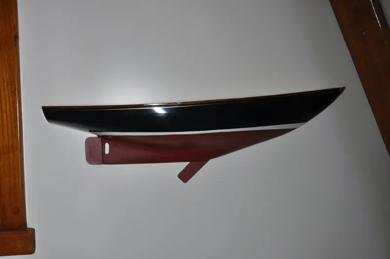 Slide: The Image of Model of a 1970 Hinckley Bermuda 40 sailboat displayed on a wall. - 40