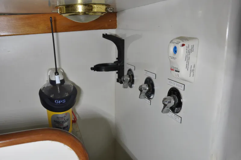 Slide: The Image of 1970 Hinckley Bermuda 40 interior controls with GPS and switches. - 41