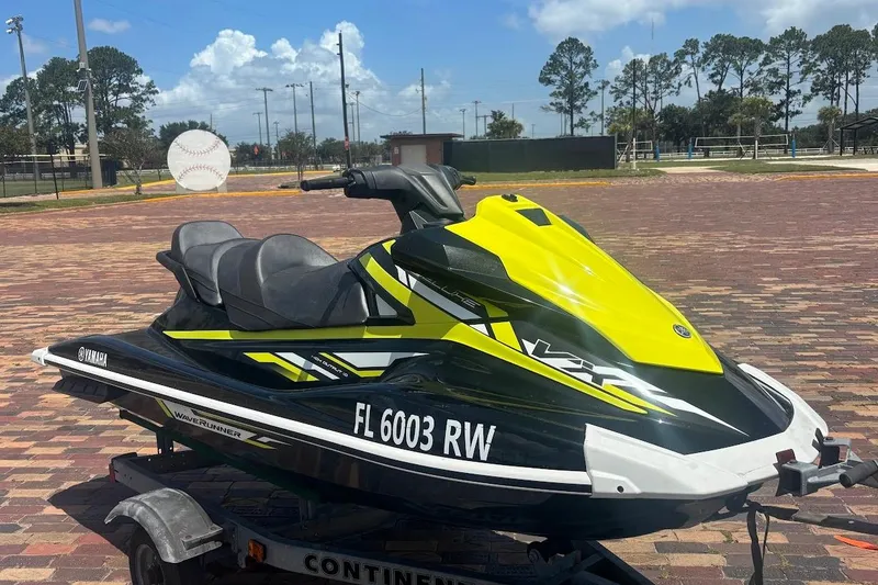 The Image of 2019 Yamaha WAVERUNNER VX DELUXE HO jet ski on trailer, parked outdoors. - 0