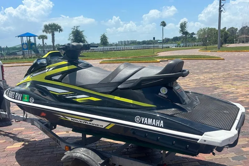 Slide: The Image of 2019 Yamaha WAVERUNNER VX DELUXE HO jet ski on trailer, parked near scenic waterfront. - 12