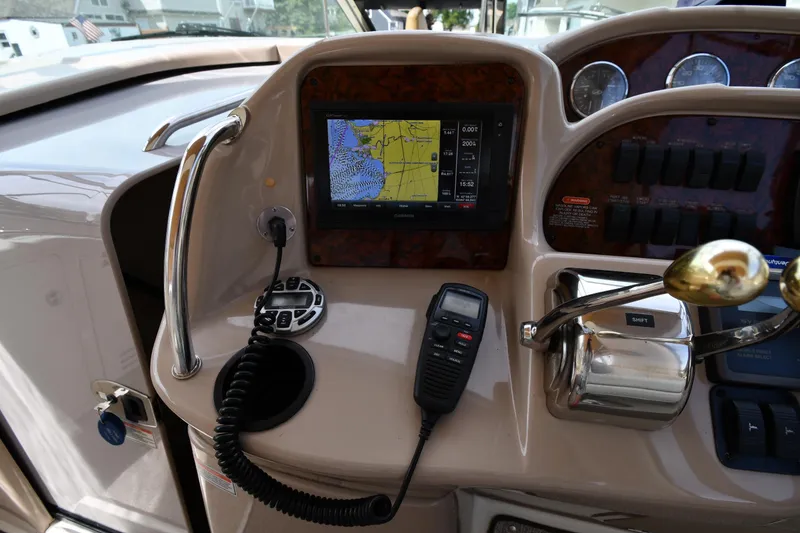 Slide: The Image of Control panel of a 2003 Sea Ray 360 Sundancer with navigation screen and radio. - 11