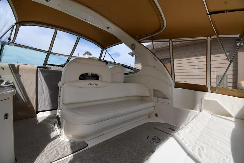 Slide: The Image of Spacious interior of 2003 Sea Ray 360 Sundancer with beige seating and canopy. - 14
