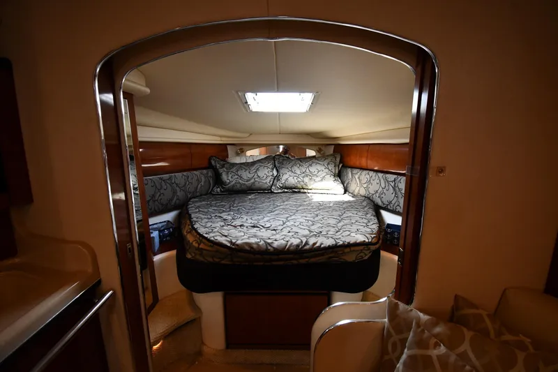 Slide: The Image of Luxurious cabin interior of 2003 Sea Ray 360 Sundancer yacht with elegant bedding. - 23