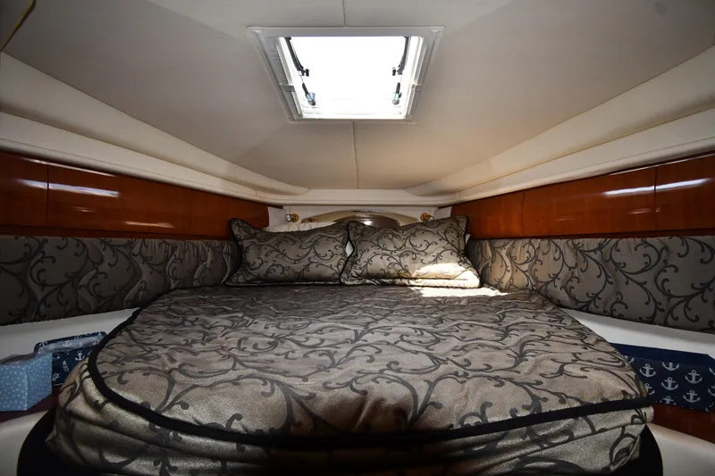 Slide: The Image of Luxurious cabin interior of 2003 Sea Ray 360 Sundancer yacht with elegant bedding. - 24