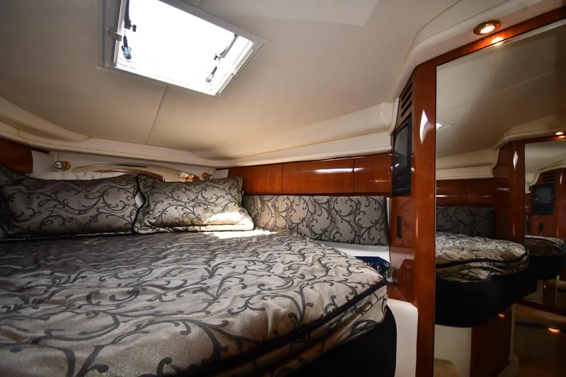 Slide: The Image of Luxurious cabin interior of a 2003 Sea Ray 360 Sundancer yacht with elegant bedding. - 25