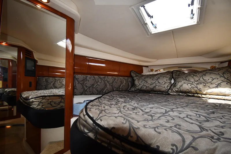Slide: The Image of Luxurious cabin interior of 2003 Sea Ray 360 Sundancer yacht with elegant bedding. - 26
