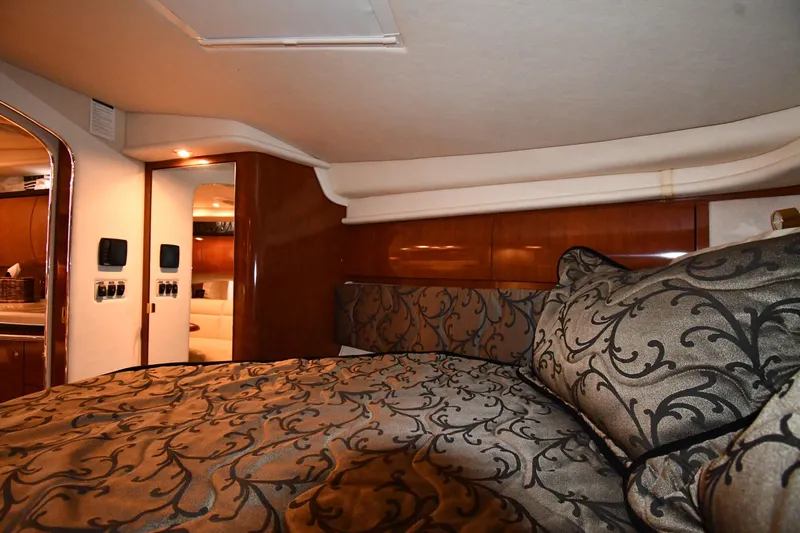 Slide: The Image of Luxurious interior cabin of a 2003 Sea Ray 360 Sundancer yacht with elegant bedding. - 27