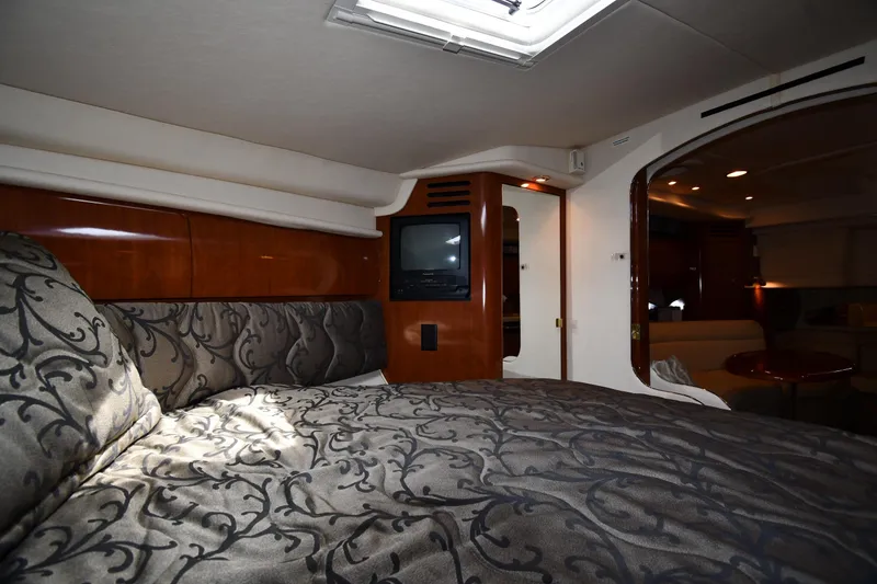 Slide: The Image of Luxurious cabin interior of 2003 Sea Ray 360 Sundancer yacht with elegant bedding. - 28