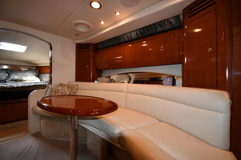 Slide: The Image of Interior of 2003 Sea Ray 360 Sundancer yacht with elegant seating and wooden cabinetry. - 29