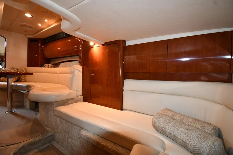 Slide: The Image of Luxurious interior of 2003 Sea Ray 360 Sundancer yacht with plush seating and elegant wood finishes. - 36