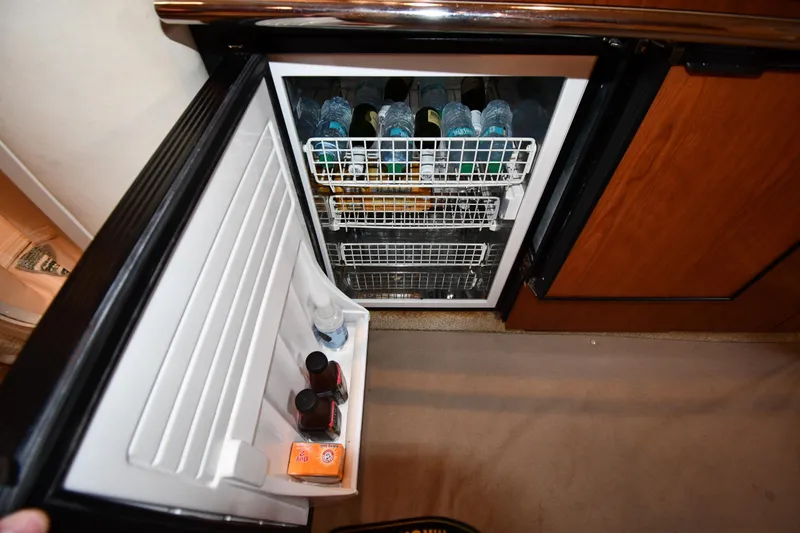Slide: The Image of Mini fridge stocked with beverages inside a 2003 Sea Ray 360 Sundancer yacht. - 42