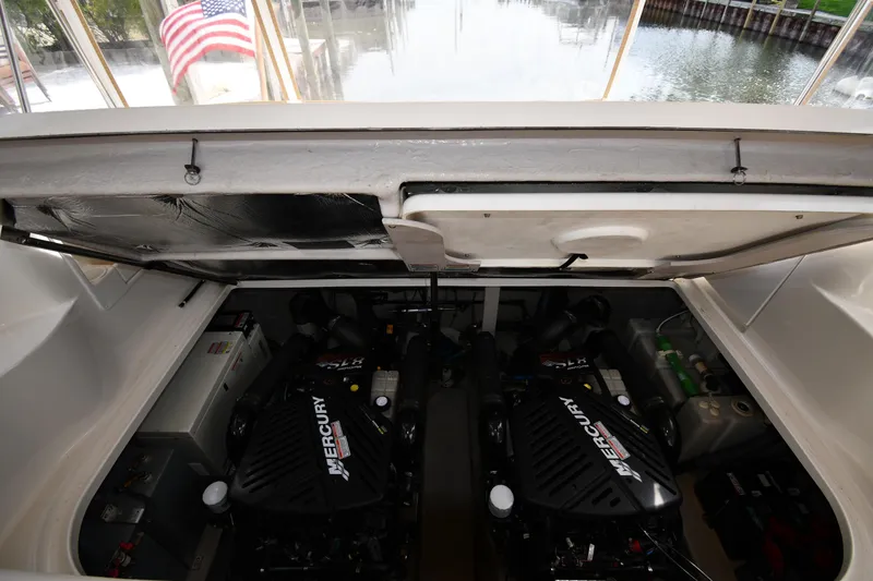 Slide: The Image of Engine compartment of a 2003 Sea Ray 360 Sundancer with Mercury engines. - 44