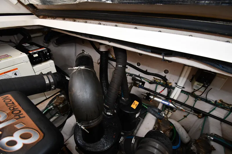 Slide: The Image of Engine room of 2003 Sea Ray 360 Sundancer with visible components and wiring. - 49