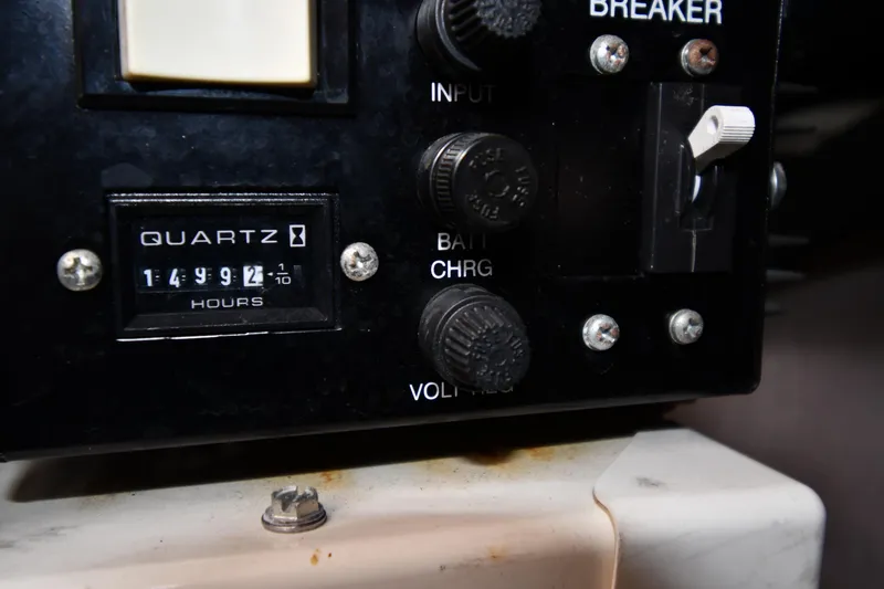 Slide: The Image of Control panel of a 2003 Sea Ray 360 Sundancer with hour meter reading 1499.2 hours. - 52