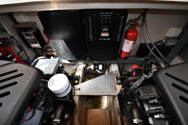 Slide: The Image of Engine room of a 2003 Sea Ray 360 Sundancer with visible components and fire extinguisher. - 53