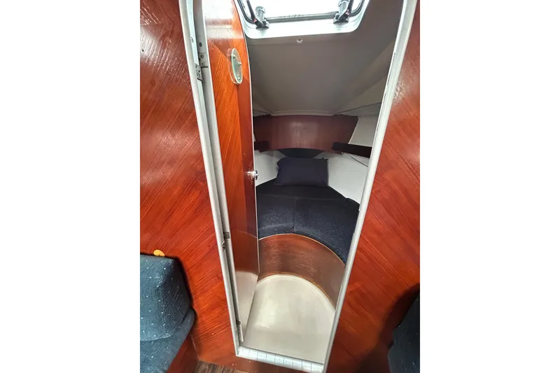 Slide: The Image of Cozy cabin interior of 1992 Beneteau First 35s5 sailboat with wooden finish. - 13