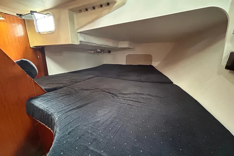 Slide: The Image of Interior cabin of 1992 Beneteau First 35s5 sailboat with black bedding. - 15