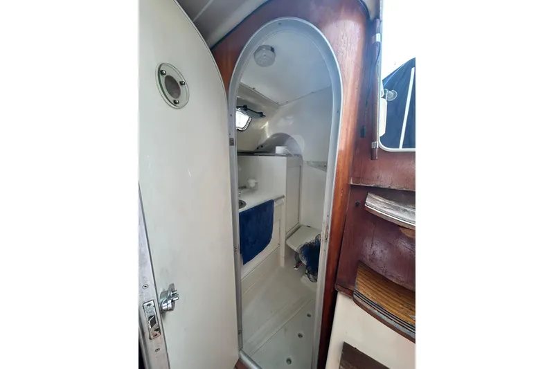 Slide: The Image of Interior view of 1992 Beneteau First 35s5 sailboat bathroom with wooden accents. - 16