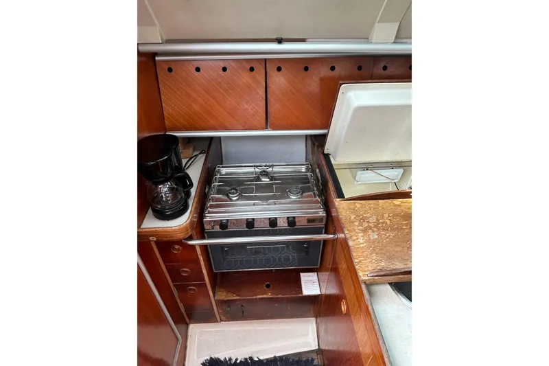 Slide: The Image of Galley kitchen in 1992 Beneteau First 35s5 sailboat with stove and coffee maker. - 18