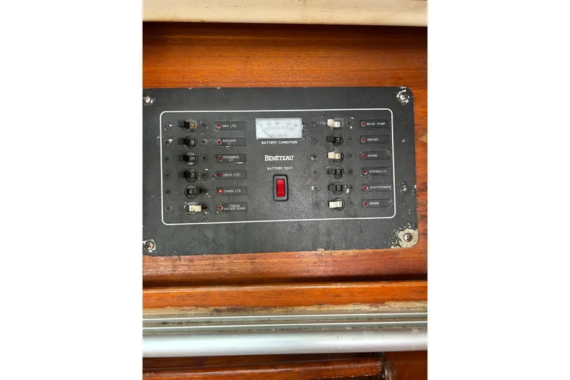 Slide: The Image of Control panel of a 1992 Beneteau First 35s5 sailboat, featuring various switches and indicators. - 21