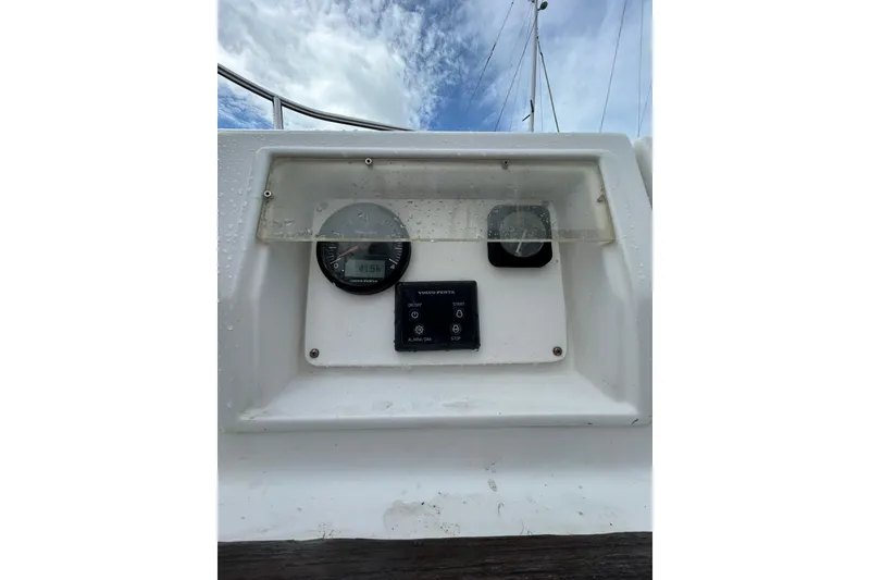 Slide: The Image of Control panel of a 1992 Beneteau First 35s5 sailboat under a cloudy sky. - 27