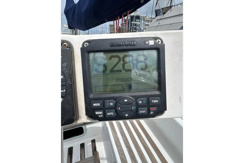 Slide: The Image of Simrad autopilot display on 1992 Beneteau First 35s5 sailboat cockpit. - 35